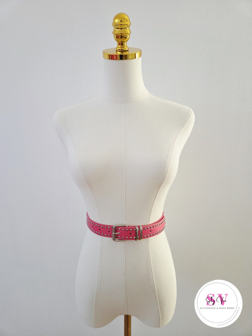 Pink belt with silver studs and buckle